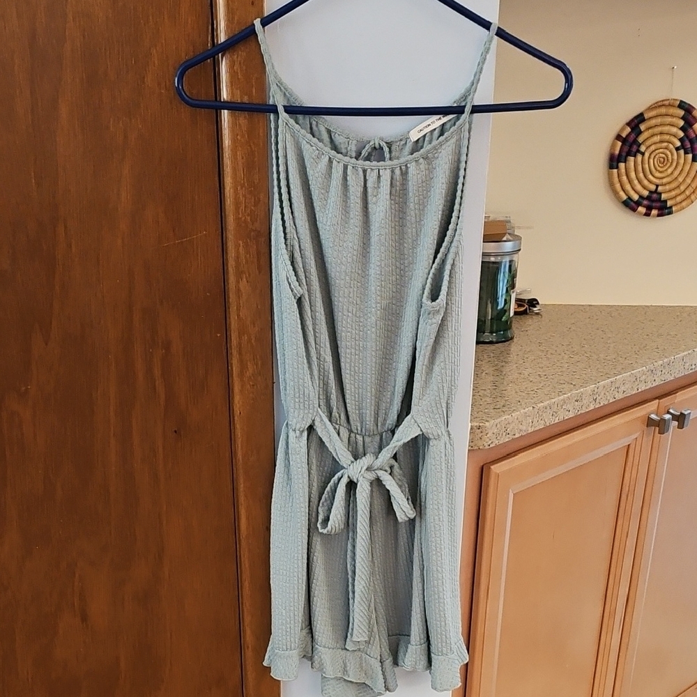 Caution To The Wind Romper In Grey-green.